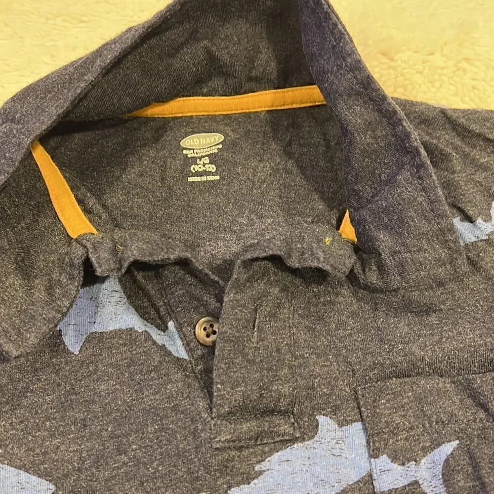 Old navy blue polo shirt with sharks size 10–12